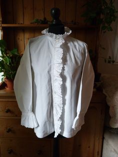 "Gorgeous example of a fine 1900's French long sleeve blouse in crisp white French cotton. Monogram A.C.  4 original mother of pearl buttons Intricate lace and white work, broderie anglaise with scalloped edging. Beautiful frill around the collar, front placket & cuffs. One faint rust mark in front (see photo) There are two listings with almost identical blouses except this one has a slight rust mark priced accordingly. Measurements  Bust 40\" Sleeve length 20\" Cuff 4.5\" across  Shoulder 5.5\" Length at back 25\" Collar 16\" Frill 1.5\" Underarm 9\" Upper arm width 8.5\" This garment must be hand washed with gentle soap with no bleaching agents. Sourced in Languedoc by myself. Please note; These items are not new and have lived long and eventful lives.  Antique fabrics mostly have flaws