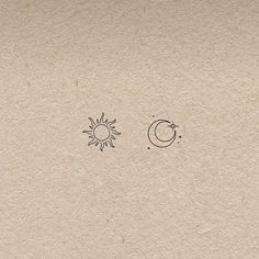 the sun, moon and stars are drawn on paper