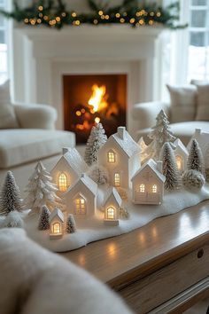 a living room filled with furniture and a fire place covered in fake snow next to a christmas tree