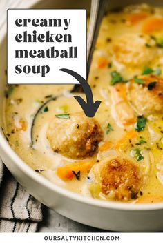 the creamy chicken meatball soup is in a white bowl and has a spoon sticking out of it