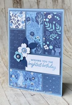 a birthday card with blue and white flowers on the front, which reads wishing you the brightest birthday