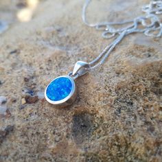 This classic silver pendant features a colorful shades blue opal, set in round shaped silver frame. An amazing Gift For your self or your loved one oooooo Pendant: 1.1 cm x 1.1 cm + hanging ♣ 925 Sterling silver 16.5 or 18 Inch chain included for FREE! *Selection criteria listed in the above shopping window ♣ Enjoy FREE SHIPPING worldwide. Suitable for both men and women oooooo If you have any questions regarding our items, please do not hesitate to contact us. We will be happy to provide the ne Blue Opal Round Pendant Jewelry, Hallmarked Blue Opal Jewelry, Blue Opal Round Necklace, Silver Box, Silver Frame, Box Chain, Blue Opal, Druzy Ring, Vintage Sterling Silver