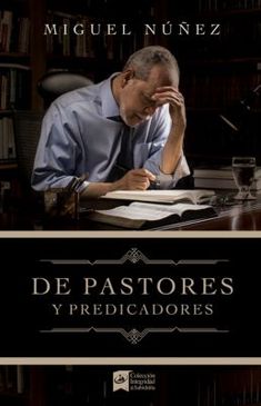 a man sitting at a desk in front of a book