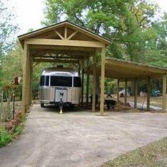 an rv is parked under a covered area