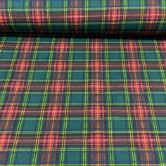 a plaid fabric with red, green and blue colors on it's surface is shown