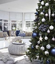 a decorated christmas tree in a living room