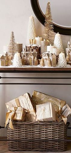 a wicker basket filled with lots of christmas decorations on top of a wooden table