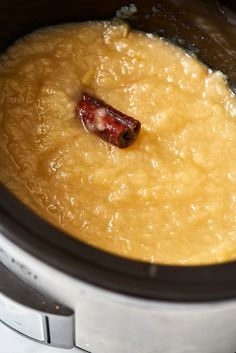 the food is being cooked in the slow cooker