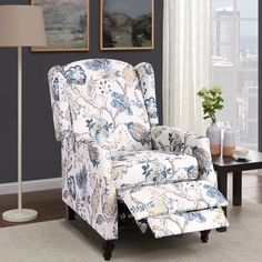 a blue and white chair in front of a window