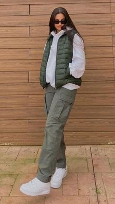 Nice Outfits Dressy Tomboy, Jeans And Vest Outfit Winter, Sweater Vest And Cargo Pants, Fall Fits Cargo Pants, Puffer Jacket With Cargo Pants, Green Puff Vest Outfit, Puffy White Vest Outfit, Ways To Style A Puffer Vest, Ambiguous Outfits