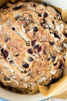 a loaf of bread with raisins and blueberries in it