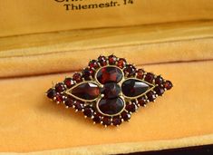 A beautiful antique gold filled Bohemian garnet brooch.   Measures: 3.3 cm x 1.9 cm (1.3" x 0.7") Weight 3.8 grams Excellent vintage condition The box on the photos for display only! Will be delivered by tracked and signed mail. Thank you for looking. Please see my other items. Antique Jewelry With Screw Back For Gift, Vintage Gemstone Brooches For Formal Occasions, Antique Screw Back Jewelry For Gift, Antique Gold Brooch With Gemstone, Antique Gold Gemstone Brooch, Antique Yellow Gold Brooches With Gemstone, Antique Red Brooch For Formal Occasions, Antique Handmade Brooches For Formal Occasions, Handmade Antique Brooches For Formal Occasions