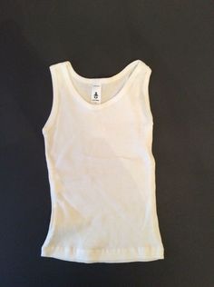 Wonderful white ribbed sleeveless tee from CLASSIC BABY NWOT Size 3 All questions appreciated and encouraged Cleaning out my Granddaughter's overstuffed closet. Most things have only been worn a handful of times. From smoke and pet free home. I will be listing many more GYMBOREE items as well as other brands. Any gently used items have all been freshly laundered. Will gladly combine items to save on shipping. PayPal preferred. White Ribbed Cotton Vest, Ribbed Tee, Downtown Outfits, Sleeveless Tee, Top Brands, Shoe Accessories, Pet, Tank Tops, Women's Top