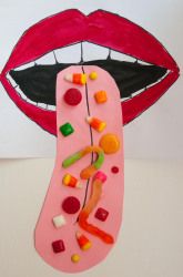 a paper plate with candy on it next to a drawing of a mouth and tongue