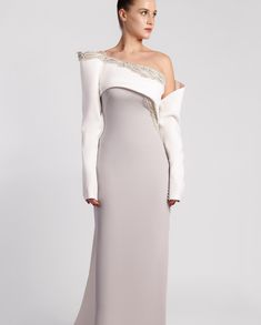 Our “Echoes of Home” Fall/Winter 24-25 collection highlights elegance with an off-white and silver crepe dress featuring an asymmetric neckline and intricate stone embroidery. Explore the collection on our website. www.gattinollibymarwan.com #GattinolliByMarwan Stone Embroidery, Asymmetric Neckline, Crepe Dress, The Collection, Highlights, Fall Winter, Off White, Embroidery, Stone