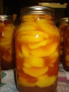 several jars filled with food sitting on top of a table