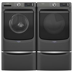 the front load washer and dryer are shown in this image, both side by side