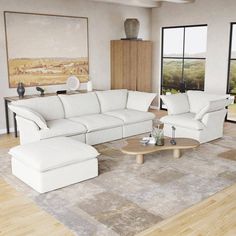 a living room filled with white furniture and large windows