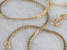 This serpentine chain is crafted from 18k yellow gold and has a beautiful polish. The links are designed to lay flat when worn, while still maintaining a degree of flexibility. Metal: 18K Yellow Gold Width of Chain: 1.8 mm Length of Chain: 16.75 Inches Marks: "750" Stamped on the clasp Chain Layering, Cameo Ring, Right Hand Rings, Brick And Mortar, Layering Necklace, Hand Engraving, Eternity Bands, New Hampshire, Chain Styles