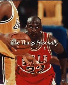 a man holding a basketball while standing next to another man with the ball in his hand