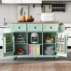 a kitchen island with lots of drawers and plates on it's wheels in front of a counter