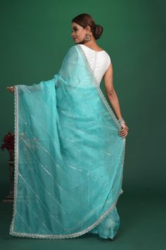 Be a vision of elegance at weddings and parties in this beautiful pastel green embroidered organza sari. It comes with a matching blouse piece. Shop designer sarees online in USA from Pure Elegance. DISCLAIMER:- The shown stitched blouse on the model is for display purpose only. The saree comes with a matching blouse piece and finished with fall and piko. Semi-stitched Pista Green Organza Traditional Wear, Pista Green Organza Saree For Wedding, Embroidered Pista Green Sharara In Organza, Pista Green Embroidered Traditional Wear In Organza, Embroidered Pista Green Organza Sharara, Embroidered Pista Green Traditional Wear In Organza, Bollywood Style Pista Green Organza Pre-draped Saree, Pista Green Organza Bollywood Traditional Wear, Bollywood Style Pista Green Organza Traditional Wear