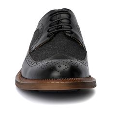 The irresistible Garret shoe by Vintage Foundry Co. exceeds expectations for a classic pair of oxfords. With its delicate design and dual-tone construction, this lace-up style stands out and demands a second look. Perfectly blending timeless elegance with a modern twist, the Garret shoe elevates any outfit, whether formal or smart-casual. Its distinctive look and superior craftsmanship ensure you make a memorable impression, combining sophistication with a bold, eye-catching design. Wingtip Oxford Lace-up Shoes With Textured Sole, Black Oxford Lace-up Shoes With Plain Toe, Black Wingtip Lace-up Shoes With Textured Sole, Black Oxford Lace-up Shoes, Black Oxford Dress Shoes With Leather Sole, Black Oxford Lace-up Shoes With Rubber Sole, Black Oxfords With Textured Sole, Black Brogue Lace-up Dress Shoes, Lace-up Oxford Shoes With Rubber Sole