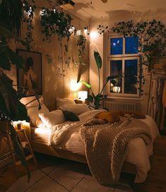 a bedroom with plants on the wall and lights in the ceiling, along with a bed