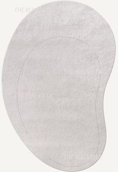 a white round rug with the word the rug on it's side and an oval shape