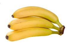 three bananas are sitting next to each other