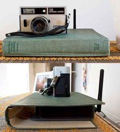 an old camera is sitting on top of a book that has been turned into a bed