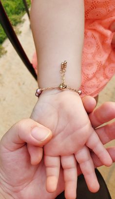 "Chunky Baby Girl Bracelet/Pearl Toddler Bracelet/Infant Jewelry/ New Baby Gift/ Little Girl Bracelet with Initial Charm Adorable little Bracelet is made from 6 mm Genuine Swarovski Pearls with 4 mm Genuine 14 K Gold Filled beads in between each Pearl. 5 color choices are available. Bracelet also comes with dainty little 14 K Gold Filled heart charm with initial of choosing stamped on the charm. Bracelet is made with adjustable clasp. The clasp simply slides up or down the chain to tighten or lo Infant Jewelry, Chunky Baby, Toddler Bracelet, Chunky Babies, Girl Bracelet, Flower Girl Bracelets, Baby Pearls, Bracelet Pearl