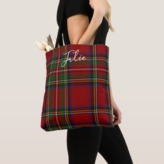 a woman carrying a red tartan plaid tote bag with personalized name on it