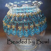 a glass vase with beaded trimmings on it