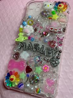 an iphone case that has many different items on the back and sides, all in clear plastic