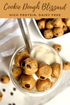 cookie dough bites are in a glass with milk and raisins on the side