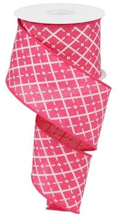 a roll of pink and white patterned ribbon