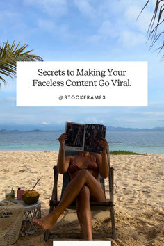 a woman sitting in a chair on the beach reading a book