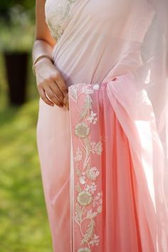 Pink ombre saree with cutdana, pearl, floral applique embroidered border. Paired with V neck blouse.
Components: 2
Pattern: Embroidery
Type Of Work: Cutdana, pearl, floral applique
Neckline: V neck
Sleeve Type: Sleeveless
Fabric: Saree: Georgette, Blouse: Cotton Silk
Color: Pink
Other Details: 
Length:
Saree: 42 inches
Blouse: 14 inches
Occasion: Reception - Aza Fashions Summer Wedding Georgette Blouse Piece, Summer Wedding Pre-draped Saree With Zari Work, Summer Wedding Pre-draped Saree With Sheer Dupatta, Summer Saree With Zari Work For Reception, Unstitched Wedding Blouse Piece For Summer, Summer Reception Saree With Zari Work, Traditional Drape Saree For Summer Wedding, Summer Wedding Blouse Piece With Cutdana Details, Summer Wedding Blouse Piece With Cutdana