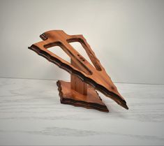 a sculpture made out of wood sitting on top of a table