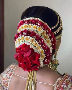 a woman wearing a head piece with flowers on it