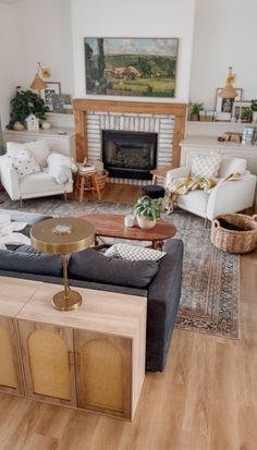 a living room filled with furniture and a fire place in the middle of the room