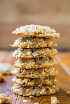 three cookies stacked on top of each other with coconut flakes all over the edges