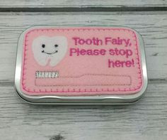 "This listing is for one embroidered tooth fairy tin. Place the tooth inside the tin and the tooth fairy takes the tooth and replaces it with money! :) Please select pink or blue from the drop down menu or leave a note if you prefer another color. Looking for a special tin set that you don't see listed? Send me a convo! I have many more designs and may have just what you are looking for! Love the design but not the colors? That's fine too! Send me a convo before ordering with your preferred colo Tooth Fairy Money, Embroidered Toilet Paper, Tooth Fairy Bag, Fairy Box, Tooth Fairy Box, Tooth Pillow, Lost Tooth, Easter Basket Fillers, Kids Dress Up