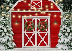 a red barn decorated for christmas with wreaths and lights