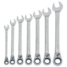 six wrenches are lined up next to each other