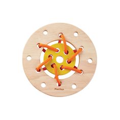 a wooden toy with an orange string on it's center and two holes in the middle