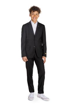 This lightweight two-button suit jacket and trousers in classic black let your child look formal without fuss. Includes jacket and trousers Jacket has notched lapels; nonfunctional three-button cuffs; chest welt pocket; front flap pockets; side vents Trousers have zip fly with button-tab closure; front slant pockets; back welt pockets 70% polyester, 27% rayon, 3% spandex Machine wash, tumble dry Imported Tuxedo For Kids, Cute Tuxedo, Kid Tuxedo, Fall Wardrobe Essentials, Look Formal, Sports Blazer, Boy Shoes, Made Clothing, Denim Leggings