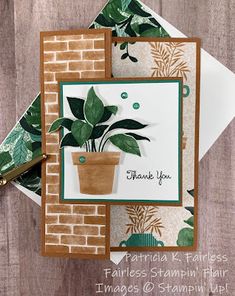 a card with a potted plant and thank you written on it