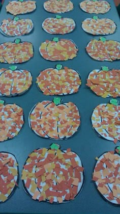 paper plates with pumpkins cut out on them are ready to be cooked in the oven